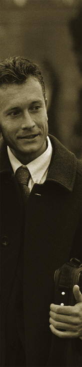Male in suit with cell phone